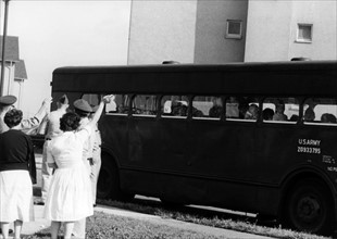 Relatives of the US Army leaving decrepit apartments