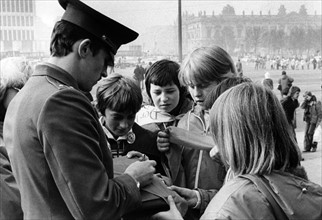 Soviet soldier gives autographs at the "Festival of Red October" in East Berlin