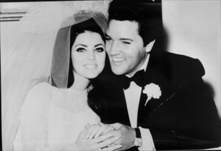 ELVIS PRESLEY
American Pop Singer and Actor
with his wife...