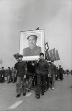 Photo: Chinese People filed through the streets with a portrait of the...