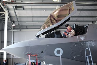 Britain's Prince Charles sits in the cockpit of a F-35 fighter jet during a visit to 617 Squadron, the UK's first F-35 Lightning Squadron based at RAF Marham