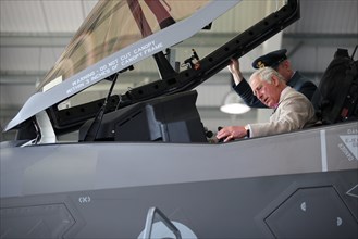 Britain's Prince Charles sits in an F-35 during a visit to 617 Squadron, the UK's first F-35 Lightning Squadron based at RAF Marham, Kings Lynn, in Norfolk