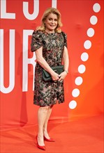 French actress Catherine Deneuve poses on the red carpet during the opening of the 23th Filmfest