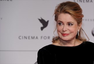 French actress Catherine Deneuve arrives at the 'Cinema
for Peace' gala at the 59th Berlin