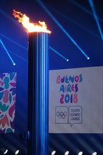 HANDOUT - 06 October 2018, Argentina, Buenos Aires: The Olympic flame burns during the opening