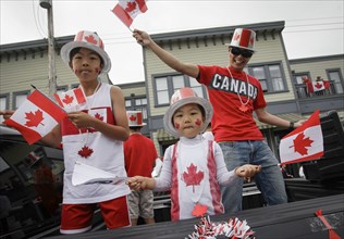 (180701) -- RICHMOND, July 1, 2018 () -- Local residents wave the national flag of Canada during