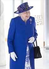 Queen Elizabeth II walks through the Garden Lobby at the Scottish Parliament in Edinburgh ahead of