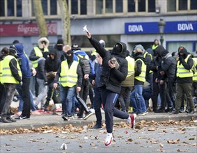 (181208) -- BRUSSELS, Dec. 8, 2018 () -- A protestor throws a stone to police during a