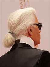 German fashion designer Karl Lagerfeld (C) arrives for the Bambi award in Wiesbaden, Germany, 10