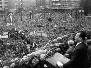 View of the demonstrating crowd while governing mayor of Berlin Willy Brandt (r) gives a speech on the 1st of May in 1958.