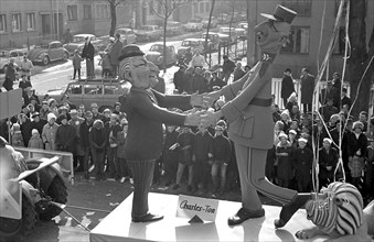 Rose Monday parade in 1963 has the slogan "Mainz continues to rejoice". The picture shows a float