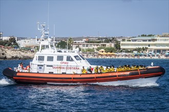 Migrants arriving on Lampedusa Island