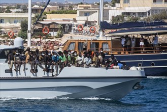 Migrants arriving on Lampedusa Island