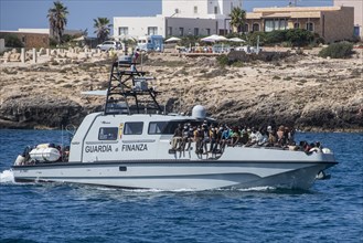 Migrants arriving on Lampedusa Island