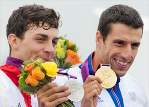 Silver medalist Sideris Tasiadis (L) of Germany and Tony Estanguet of France
