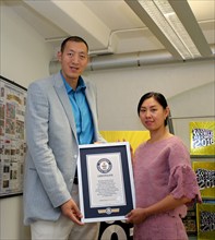 Sept. 10, 2015 () -- China's Sun Mingming and his wife Xu Yan pose for a photo during their visit