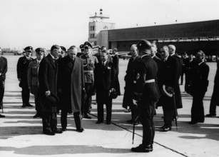 British Premier Neville Chamberlain returns to London after the second meeting with Hitler in