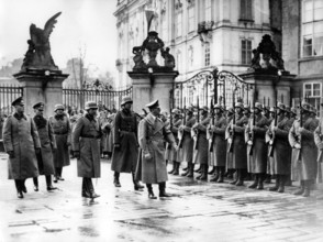 The image from the Nazi Propaganda! shows Adolf Hitler marching past an honorary company in the