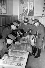 The Nazi propaganda picture shows how Nazi election posters are prepared for the Parliamentary