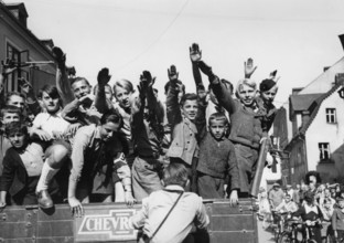 The Nazi propaganda picture shows Sudeten German children doing the Nazi salute in As, Czech