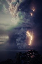 The billows of smoke with lightning is seen from the eruption of the volcan island Taal .The Taal