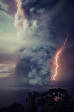 The billows of smoke with lightning is seen from the eruption of the volcan island Taal .The Taal