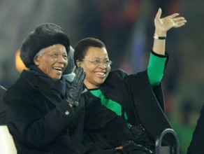 Former South African President Nelson Mandela and his wife Graca Machel smile during the closing