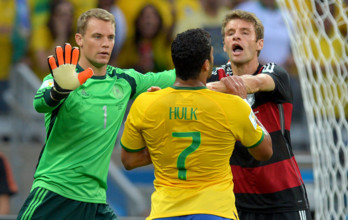 Germany's goalkeeper Manuel Neuer (L), Thomas Mueller, and Brazil's Hulk (C) argue with each other