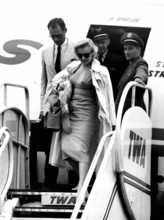 Marilyn Monroe and her husband Arthur Miller arrive at London airport. 14th July 1956