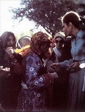 Farah Pahlavi visiting lepers, city of Machad