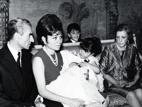 Mohammed Reza Shah Pahlavi, his wife Farah Diba and their first born, Reza
(1960)