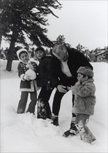 Mohammed Reza Shah Pahlavi playing with his children