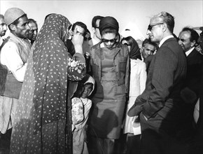 Reza Shah Pahlavi and his wife Farah visiting villagers in Iran
