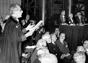 Cocteau delivering a speech at the Académie Française, 1955