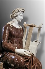 Statue of the goddess Rome playing a zither