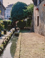 Old washhouse on a street in Milan