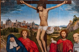 “Crucified Christ with the Virgin, St. John the Baptist and the Evangelist, Mary Magdalena and two cistercian abbots”, by Hans Memling