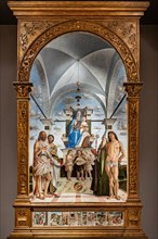 “Enthroned Madonna with infant Jesus  among Saints John the Baptist, Bartholomew, Agustine, Sebastian and three angels playing music”, by Bartolomeo Montagna