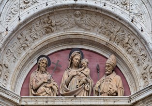 Montepulciano, church of St. Augustine: detail of the portal with the lunette with the terracotta