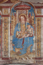 Chiesa di San Defendente, affreschi sotto la lunetta del portale (1483): Madonna in trono con