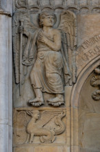 Fidenza, cathedral (Cathedral of San Donnino), facade, panel: an angel indicating the via