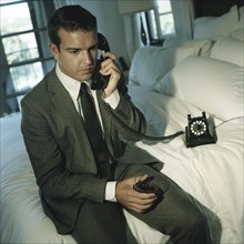 Young Man in Suit on the Phone