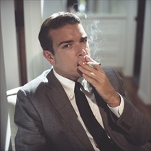Sharp Dressed Man Smoking Cigarette