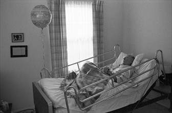 Elderly Man in Hospital Bed