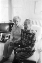 Eldery Couple Sitting and Holding Hands