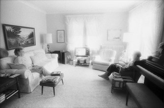 Elderly Couple Sitting in Living Room