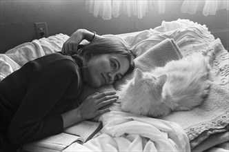 Woman and Cat on Bed