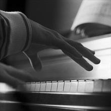 Hand Playing Piano, Close-Up