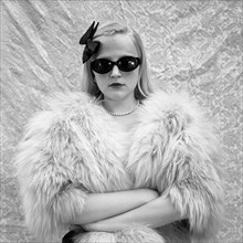 Blonde Girl in Sunglasses and Fur Coat