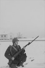 Military Soldier in Uniform Kneeling in Snow with Rifle & Bayonet, Portrait, WWII, HQ 2nd Battalion, 389th Infantry, US Army Military Base, Indiana, USA, 1942